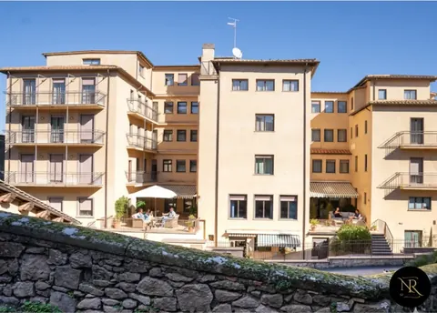 The building seen from Viterbo's medieval walls, with terraces overlooking the historic centre